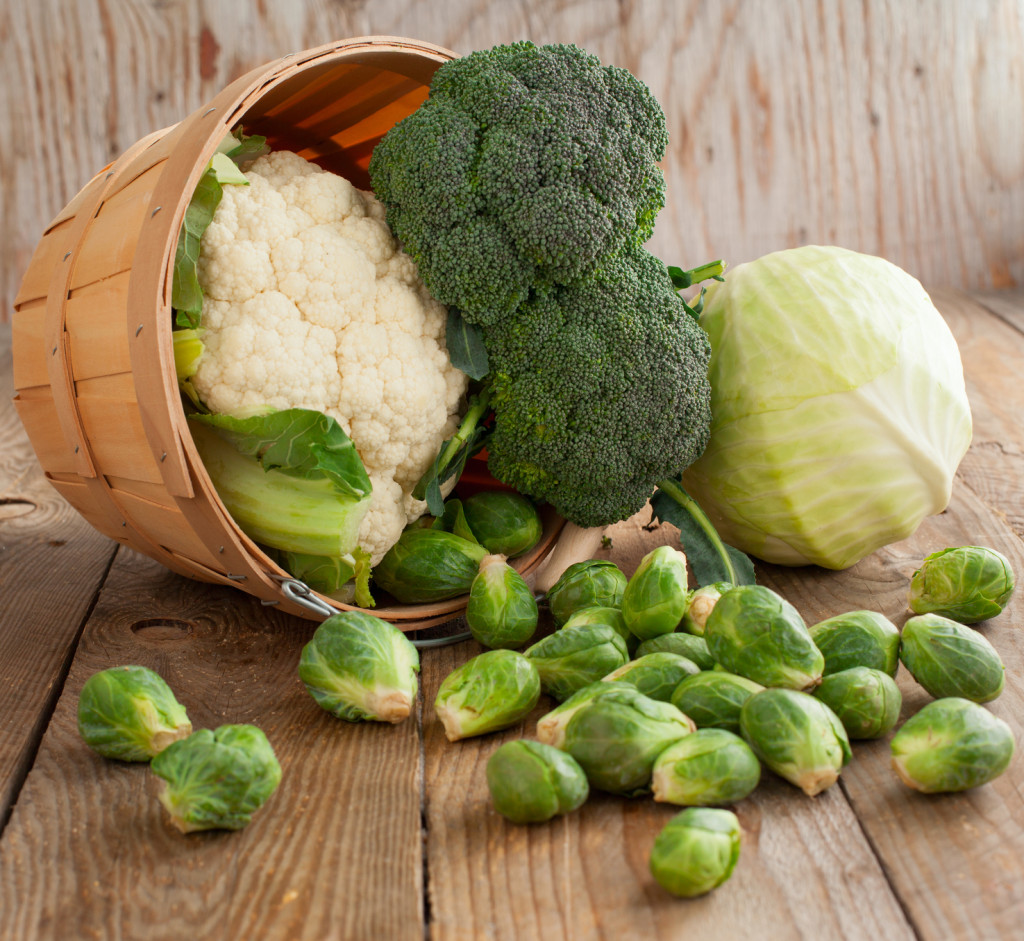 assortment cabbages on wooden background
